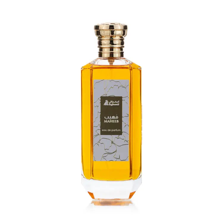 Close-up of the Maheeb eau de parfum bottle, showing the floral label in olive green and gold on the front of the hexagonal bottle
